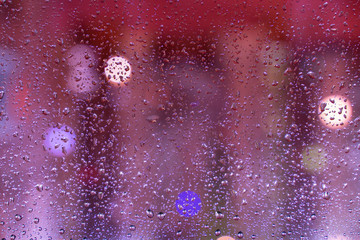 rain drops on glass with a beautiful blurred background