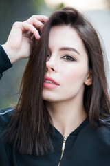 Close up portrait of beautiful young brunette woman 