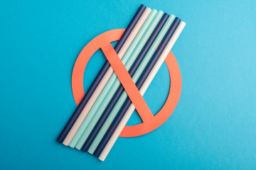 Abstract a colorful of plastic straws used for drinking water or soft drinks. concept of protest on blue background. No Plastic. Copy space for text.
