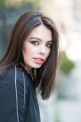 Obraz premium Close up portrait of beautiful young brunette woman 