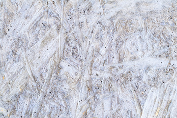 texture. imprint on the concrete screed osb plate. daylight. there is tinting.