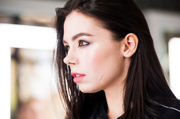 Close up portrait of beautiful young brunette woman 