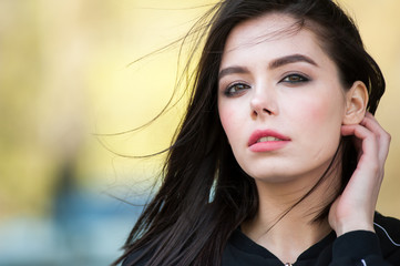 Beautiful smiling young woman wearing black jacket