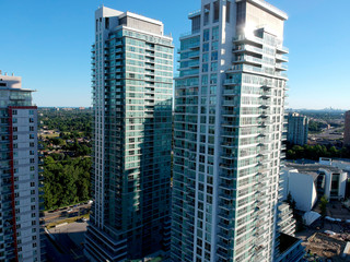 Residential skyscrapers close up skyline, aerial view of the American city. Housing buildings and high rise glass houses concept. Modern life rentals or mortgage.