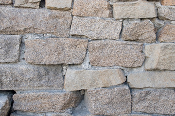 stone laying at the bottom of the base of the house