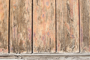 Wooden fence with peeling paint