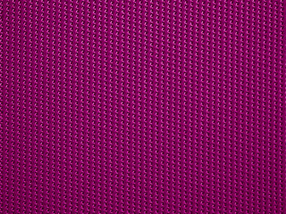 Close-up of purple fabric plastic textile lattice or grid texture. Horizontal and vertical crossover lines. A lattice work of interwoven purple plastic textile textured strips forms pattern background