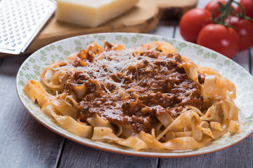 Italian ragu bolognese with flat fettuccine pasta
