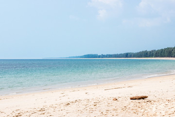 seascape at empty tropical beach with green island
