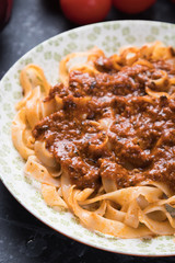 Italian ragu bolognese with flat fettuccine pasta