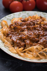 Italian ragu bolognese with flat fettuccine pasta