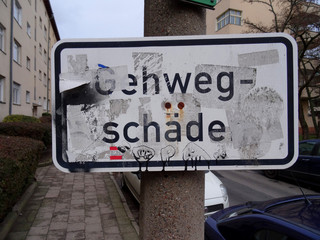BERLIN - January 2019: Street sign pavement damage