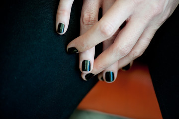 Black manicured fingernails