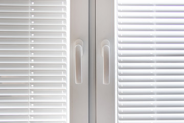Fototapeta premium White windows with blinds