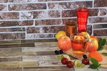 Grape and apple juice, fruit on a wooden background. Cool drinks, a mix of different varieties of...