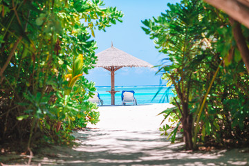 Beach wooden chairs for vacations on tropical beach