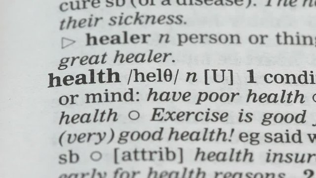 Health, pencil pointing word in dictionary, condition of body and mind, care