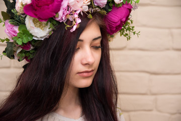 Obraz na płótnie Canvas Portrait of a girl with a corolla on her head. Wreath - Traditional Ukrainian headdress of girls.