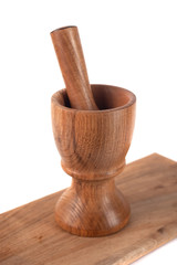 Wooden mortar (pounder) and pestle isolated on white