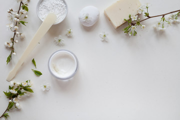 White background with organic cosmetics with natural ingredients. Top view.