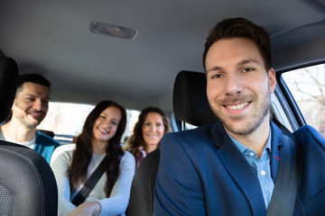 Smiling People Sitting In Car