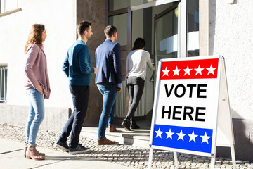 People Standing Outside Voting Room