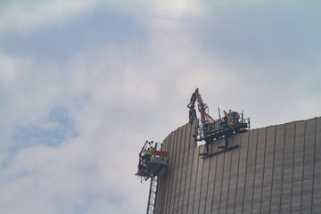 the cooling tower of a nuclear power plant is demolished
