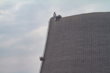the cooling tower of a nuclear power plant is demolished