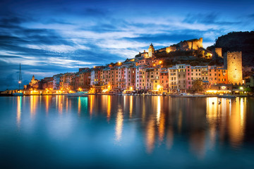 Fototapeta na wymiar Beautiful coastal town Portovenere in Cinque Terre national park, Liguria, Italy. Famous small Italian city, Cityscape in Sunset time.
