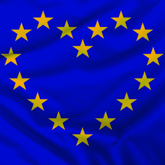 European Union flag in the form of a heart of stars on a silk fabric with pleats