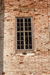 Fototapeta na wymiar The walls of the Russian destroyed church of red brick