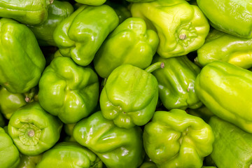Fototapeta na wymiar Green peppers as backgouund, close up