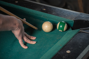 Billiards balls and cue on billiards table. Billiard sport concept