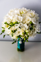 Charming bouquet of white freesia with satin ribbon