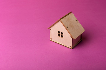 Obraz na płótnie Canvas Minimal design with miniature wood toy house.