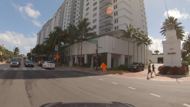 Driving plates Miami Beach stock video turning onto collins avenue 4k