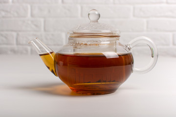 Teapot with black tea.