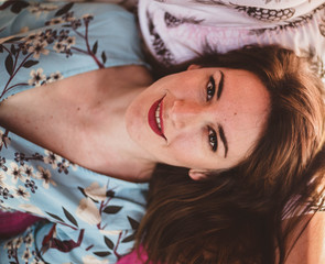 portrait of a beautiful young woman smiling with intense look