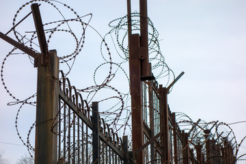 iron fence with barbed wire