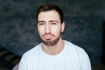 Fototapeta premium front view of handsome sad man with beard