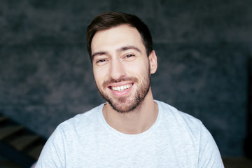 Fototapeta premium handsome bearded man looking at camera with smile