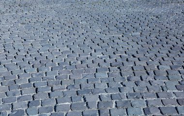 Stone pavement texture.  Old cobblestone abstract background. Close up.