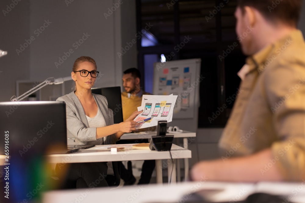 Poster business, deadline and technology concept - software developers discussing user interface design moc