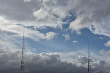 Obraz premium electric posts with cloud formations 