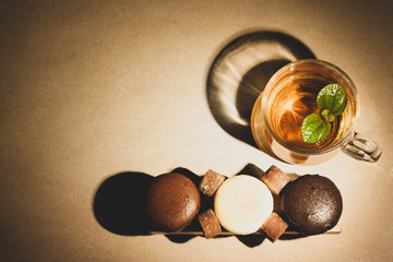 Cheese cakes,tea cup and sugarcane with wood on paper. Sweetmeat concept. Original, choco and macha...