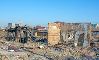 Fototapeta premium The ruins of a private house, after a fire and demolition.
