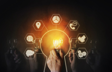 Hand with light bulb. Business Strategy Planning