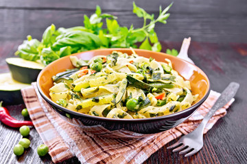 Tagliatelle with green vegetables on napkin
