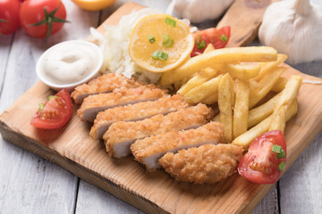 Breaded cutlet with french fries