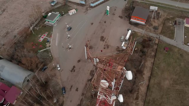 Flying around the communications tower. Aerial footage from a copter